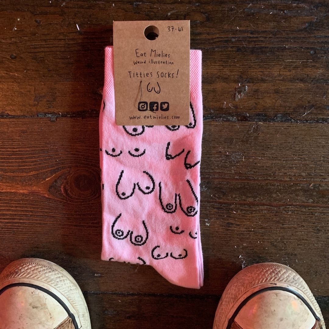 A pair of pink socks with hand-drawn Titties on them. Part of our Cool Socks Collection.