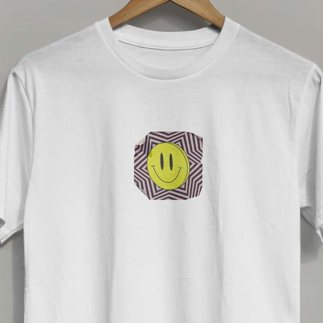 Close-up of rave face design on a short-sleeved white cotton tee
